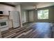 Bright kitchen boasts white cabinets, new appliances, and wood-look floors at 3233 Lenwood Dr, New Port Richey, FL 34655