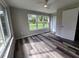 Bright bedroom with vinyl flooring and large windows at 3233 Lenwood Dr, New Port Richey, FL 34655