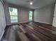 Bright bedroom with wood-look floors and ceiling fan at 3233 Lenwood Dr, New Port Richey, FL 34655