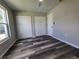Bedroom with double closets and vinyl flooring at 3233 Lenwood Dr, New Port Richey, FL 34655