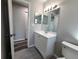 Clean bathroom with vanity and access to other rooms at 3233 Lenwood Dr, New Port Richey, FL 34655