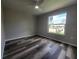 Spacious bedroom featuring vinyl flooring and a window at 3233 Lenwood Dr, New Port Richey, FL 34655
