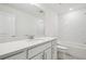 A well-lit bathroom features a modern vanity, subway tiles, and a combined tub and shower at 6681 Michael Favor Way, Wesley Chapel, FL 33545