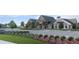 Community clubhouse with ample parking and beautiful landscaping at 6681 Michael Favor Way, Wesley Chapel, FL 33545