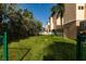 Grass yard with a soccer ball and building in background at 3333 Pasadena S Ave # A1, South Pasadena, FL 33707