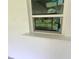 Impact resistant window showcasing backyard view at 3233 Lenwood Dr, New Port Richey, FL 34655