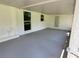 Large screened porch with view of the backyard at 3233 Lenwood Dr, New Port Richey, FL 34655