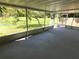 Spacious screened porch overlooking backyard at 3233 Lenwood Dr, New Port Richey, FL 34655