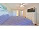 Bedroom with a queen bed, dresser, and access to a bathroom at 5725 80Th N St # 316, St Petersburg, FL 33709