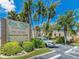 Sea Club Condominiums entrance with parking and lush landscaping at 19725 Gulf Blvd # 20, Indian Shores, FL 33785