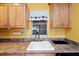 Kitchen features a white sink and wood cabinets at 1630 Bentwood Dr, Sun City Center, FL 33573