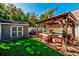Relaxing backyard oasis with a gazebo and patio furniture at 615 Grove N St, St Petersburg, FL 33701