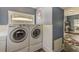 Laundry room with LG washer and dryer, and additional storage at 615 Grove N St, St Petersburg, FL 33701