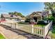 Charming gray house with a white picket fence at 615 Grove N St, St Petersburg, FL 33701