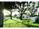 Spacious backyard with large trees and a privacy fence at 1218 Hummingbird Ln, Brandon, FL 33511