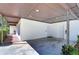 Covered parking area with extra storage and EV charger at 1802 E Hamilton Ave, Tampa, FL 33610
