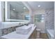 Modern bathroom with double vanity and marble tile at 1802 E Hamilton Ave, Tampa, FL 33610