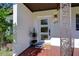 Modern front door with tiled porch and decorative railing at 1802 E Hamilton Ave, Tampa, FL 33610