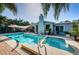 Pool and spa with patio and lush tropical landscaping at 13191 92Nd Ave, Seminole, FL 33776