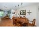 Dining room with wood table and chairs, and view into adjacent living area at 13191 92Nd Ave, Seminole, FL 33776