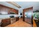 Updated kitchen with stainless steel appliances and wood cabinets at 13191 92Nd Ave, Seminole, FL 33776