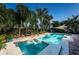 Large pool and spa surrounded by tropical plants at 13191 92Nd Ave, Seminole, FL 33776