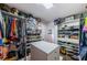 Spacious walk-in closet with custom shelving and drawers at 13191 92Nd Ave, Seminole, FL 33776