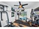 Home gym with various exercise equipment and pool view at 13191 92Nd Ave, Seminole, FL 33776