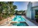 Relaxing pool and spa area with patio and tropical plants at 13191 92Nd Ave, Seminole, FL 33776