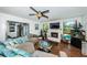 Comfortable living room with fireplace and access to the pool at 13191 92Nd Ave, Seminole, FL 33776