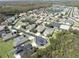 An aerial view of a residential neighborhood featuring single-Gathering homes and community landscaping at 1342 Salmonberry St, Wesley Chapel, FL 33543