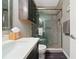 Bathroom featuring a granite countertop, new cabinets, and tiled shower at 1342 Salmonberry St, Wesley Chapel, FL 33543