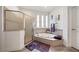 Bathroom featuring a walk-in shower and a large soaking tub at 1342 Salmonberry St, Wesley Chapel, FL 33543