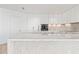 Sleek kitchen featuring white shaker cabinets and marble island at 2912 W Santiago St # 1901, Tampa, FL 33629