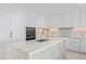Modern kitchen with marble island, gold faucet, and built-in oven at 2912 W Santiago St # 1901, Tampa, FL 33629