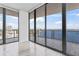 Living room featuring panoramic water views and floor-to-ceiling windows at 2912 W Santiago St # 1901, Tampa, FL 33629