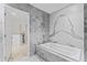 Bathroom with marble bathtub and walk-in shower at 2912 W Santiago St # 1901, Tampa, FL 33629