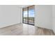 Bright bedroom with floor-to-ceiling windows and city views at 2912 W Santiago St # 1901, Tampa, FL 33629