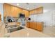 Modern kitchen with granite countertops and an island at 7296 Marathon Dr # 603, Seminole, FL 33777