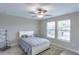 Cozy bedroom with a comfortable bed and plenty of natural light at 9612 Little Bluestem Dr, Land O Lakes, FL 34637