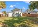 Spacious backyard with grassy area and wooden fence at 4910 Chancellor Ne St, St Petersburg, FL 33703