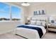 Bedroom with a white bed frame and water view at 31873 Anchor Point Dr, Wesley Chapel, FL 33545