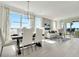 Bright dining room with large windows and stylish dining set at 31873 Anchor Point Dr, Wesley Chapel, FL 33545