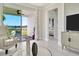 Bright living room with sliding glass doors leading to a patio and view of water at 31873 Anchor Point Dr, Wesley Chapel, FL 33545