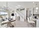 Open concept dining room with a large table and access to the kitchen at 31873 Anchor Point Dr, Wesley Chapel, FL 33545