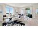 L-shaped sectional sofa in living room with access to balcony and water view at 31873 Anchor Point Dr, Wesley Chapel, FL 33545