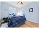 Bright bedroom with a comfortable bed, and plenty of natural light at 1342 Salmonberry St, Wesley Chapel, FL 33543