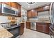 Modern kitchen featuring stainless steel appliances and wood cabinets at 4101 Cortez S Way, St Petersburg, FL 33712