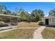 Large backyard with screened porch and shed at 5838 Wyoming Ave, New Port Richey, FL 34652