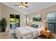 Spacious bedroom with a king-size bed and sliding door to patio at 9044 Westbay Blvd, Tampa, FL 33615